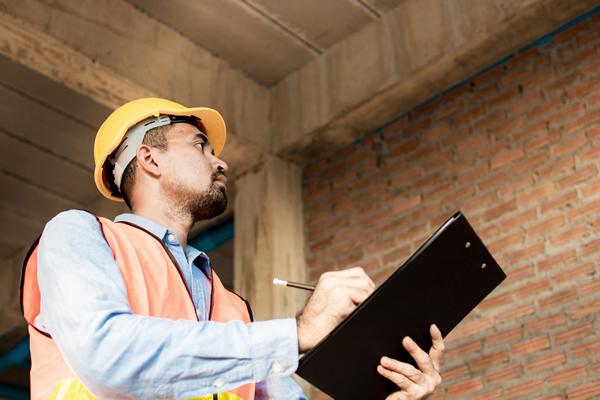 Inspector holding clipboard