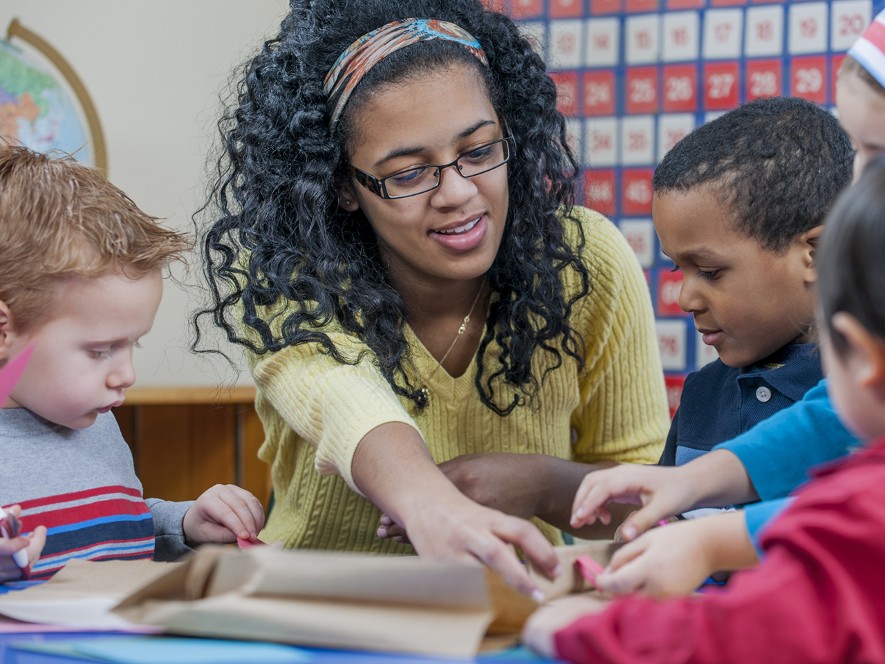 teacher with young students