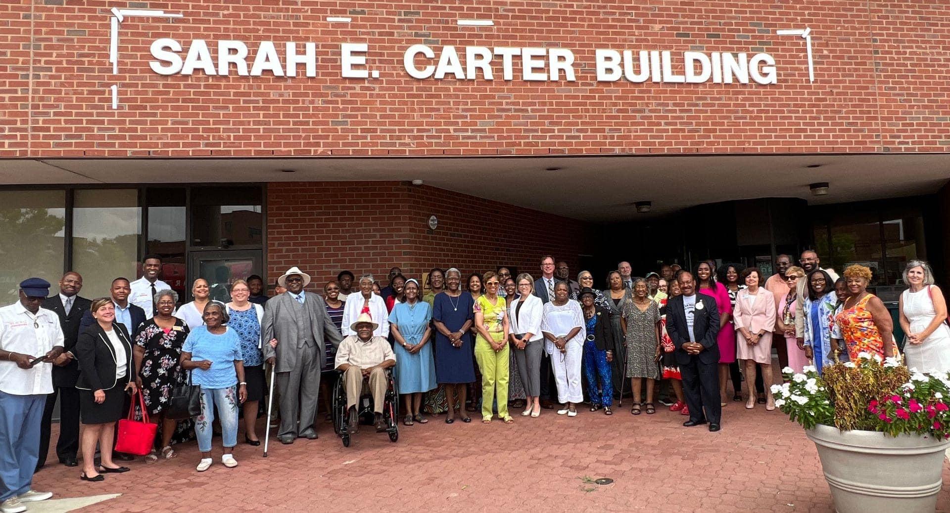 Sarah Carter Group Photo In front of Building