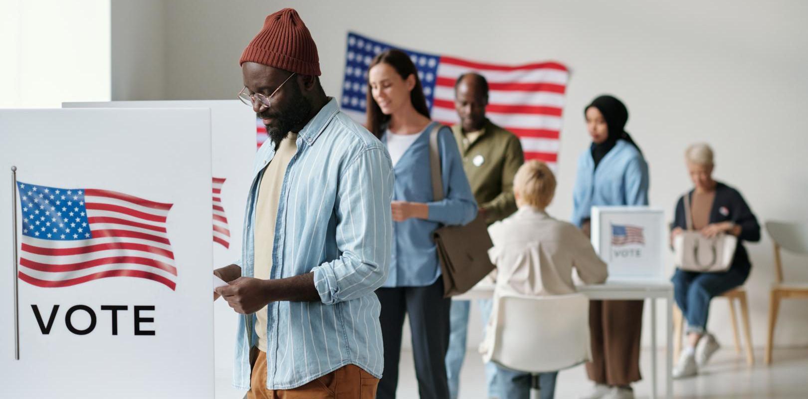 People standing in line waiting to vote