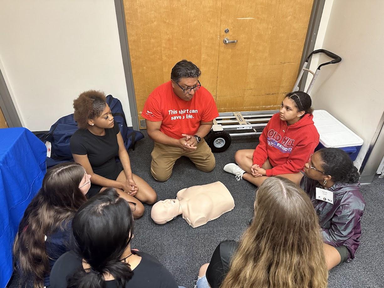 Campers learning CPR